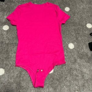 Hot pink body suit and black bodysuit